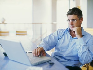 Man-on-computer-300x227 Man-on-computer-300x227